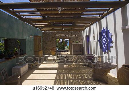 Stock Photo - Shaded livingroom in house Brazilian beach house.. Fotosearch