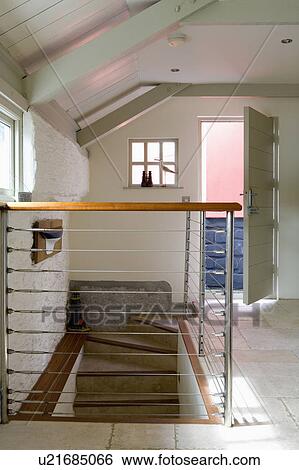Ship's railings used as banisters in modern white hall in converted coastal boathouse View Large Photo Image Stock Photograph - Ship's railings used as banisters in modern white hall in converted coastal boathouse. Fotosearch