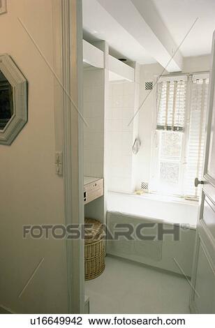 Stock Image - Small grey bathroom. Fotosearch