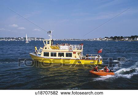 Small orange boat beside yellow passenger boat on the sea in Poole Harbour in Dorset View Large Photo Image Stock Image - Small orange boat beside yellow passenger boat on the sea in Poole Harbour in Dorset. Fotosearch