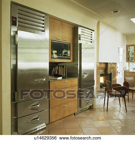 Stainless steel fitted fridge-freezer in moddern kitchen View Large Photo Image Stock Photograph - Stainless steel fitted fridge-freezer in moddern kitchen. Fotosearch