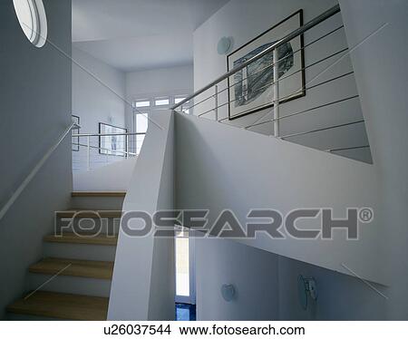 Picture - Staircase in double-heigh hall with ship's railing bannisters. Fotosearch