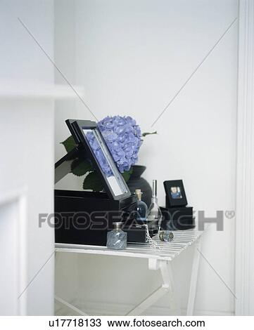 Still-life of blue hydrangea flower with perfume bottles and black lacquer boxes View Large Photo Image Stock Image - Still-life of blue hydrangea flower with perfume bottles and black lacquer boxes. Fotosearch