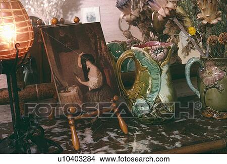 Still-Life of ornate thirties jugs and small painting on stand View Large Photo Image Picture - Still-Life of ornate thirties jugs and small painting on stand. Fotosearch
