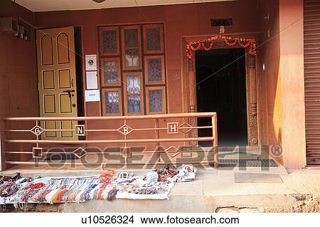 Street wares for sale outside colourful building in India. View Large Photo Image Picture - Street wares for sale outside colourful building in India.. Fotosearch