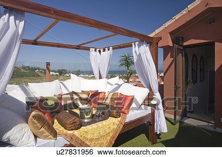 Sun lounger on roof of villa overlooking golf course. View Large Photo Image Stock Photograph - Sun lounger on roof of villa overlooking golf course.. Fotosearch