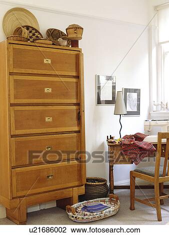 Tall modern chest-of-drawers View Large Photo Image Stock Image - Tall modern chest-of-drawers . Fotosearch