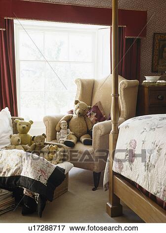 Teddybears on armchair in country bedroom View Large Photo Image Stock Photo - Teddybears on armchair in country bedroom. Fotosearch