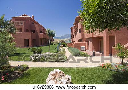 Stock Photograph - Terracotta coloured new villas for sale in Spain.. Fotosearch