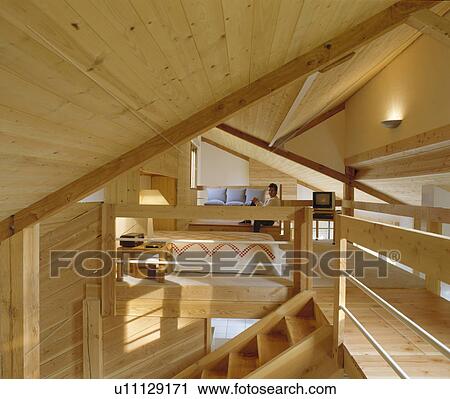 Tongue+groove panelling in attic conversion with bedroom and living room View Large Photo Image Stock Image - Tongue+groove panelling in attic conversion with bedroom and living room. Fotosearch
