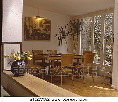 Upholstered pale brown leather chairs in modern dining room View Large Photo Image Stock Image - Upholstered pale brown leather chairs in modern dining room. Fotosearch