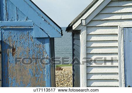 View of the sea between blue and white wooden beach huts View Large Photo Image Stock Photo - View of the sea between blue and white wooden beach huts. Fotosearch