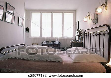White lace pillows on black metal bed View Large Photo Image Stock Image - White lace pillows on black metal bed. Fotosearch