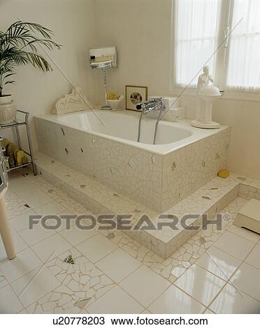 White mosaic and mirror-mosaic floor and bath surround in Thirties-style bathroom View Large Photo Image Stock Image - White mosaic and mirror-mosaic floor and bath surround in Thirties-style bathroom. Fotosearch