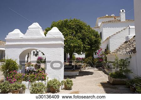 White stucco building Arcos de la frontera in Southern Spain View Large Photo Image Stock Photo - White stucco building Arcos de la frontera in Southern Spain. Fotosearch