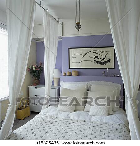 White voile drapes on bed with white linen in mauve bedroom View Large Photo Image Stock Photography - White voile drapes on bed with white linen in mauve bedroom. Fotosearch