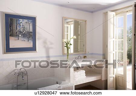 Stock Photo - Whitetiled bathroom at Arcos de la frontera Hotel in Southern Spain. Fotosearch