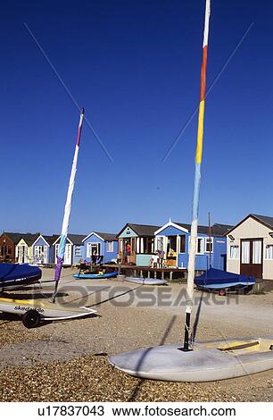 Windsails in front of row of brightly coloured beach huts at Mudeford in Hampshire View Large Photo Image Stock Image - Windsails in front of row of brightly coloured beach huts at Mudeford in Hampshire. Fotosearch