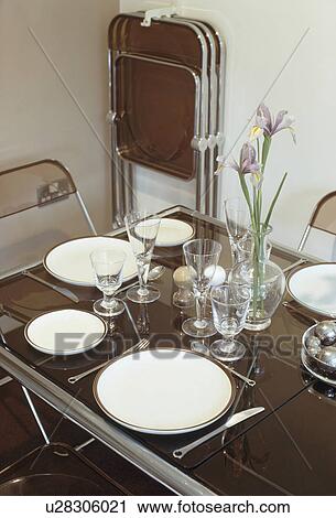 Wine glasses and white crockery on table set for lunch View Large Photo Image Stock Image - Wine glasses and white crockery on table set for lunch. Fotosearch
