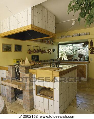 Yellow kitchen with white tiled units View Large Photo Image Stock Image - Yellow kitchen with white tiled units. Fotosearch