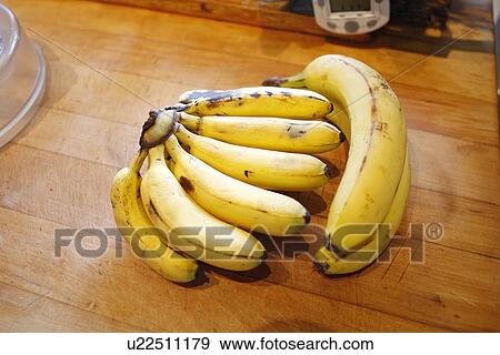Stock Photo - Bunch of baby Bananas and normal-sized Banana. Fotosearch