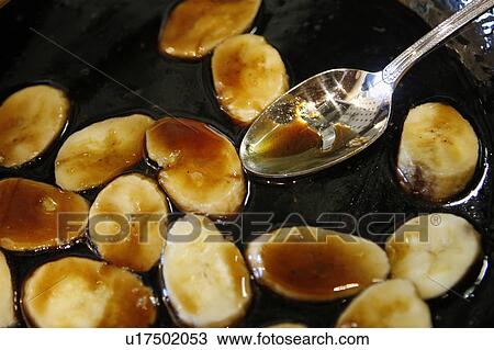Stock Image - Caramelized Bananas in Pan. Fotosearch