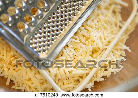 Stock Photo - Cheese with Grater. Fotosearch