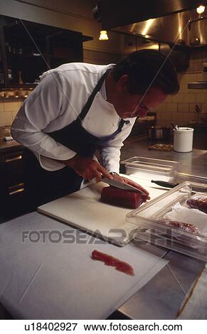 Stock Photo - Chef slicing Tuna. Fotosearch
