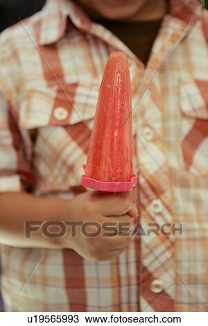 Stock Image - Child with Watermelon Ice Pop. Fotosearch