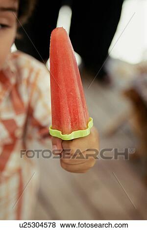 Stock Photo - Child with Watermelon Ice Pop. Fotosearch