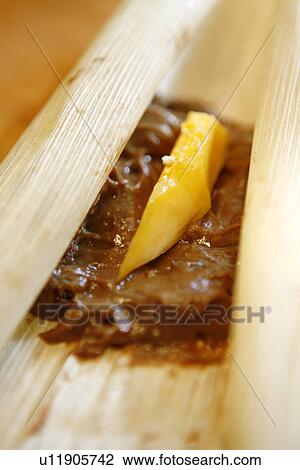 Chocolate and Papaya in Tamale Corn Husk View Large Photo Image Stock Image - Chocolate and Papaya in Tamale Corn Husk. Fotosearch