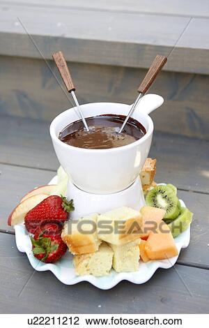 Stock Image - Chocolate Fondue with Orange Blossom Pound Cake. Fotosearch