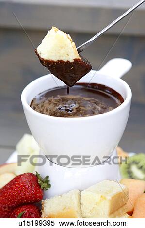 Stock Photography - Chocolate Fondue with Orange Blossom Pound Cake. Fotosearch