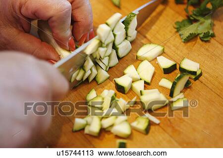 Stock Image - Chopping Courgette. Fotosearch