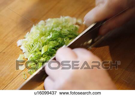 Stock Photo - Chopping Scallions. Fotosearch