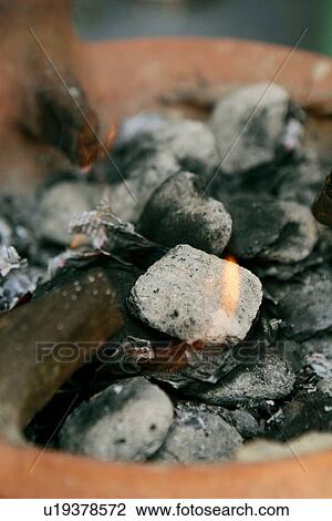 Stock Image - Coals in Tagine. Fotosearch