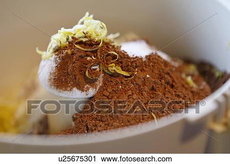 Stock Image - Cocao Powder with Lemon Zest / cake ingredients. Fotosearch