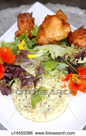 Stock Photograph - Corn Custard and Tomato Fritters. Fotosearch