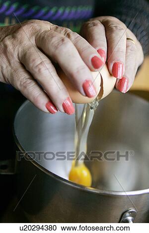 Stock Image - Cracking an Egg. Fotosearch