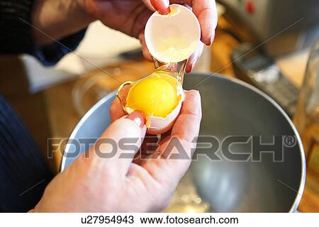 Stock Image - Cracking an Egg. Fotosearch