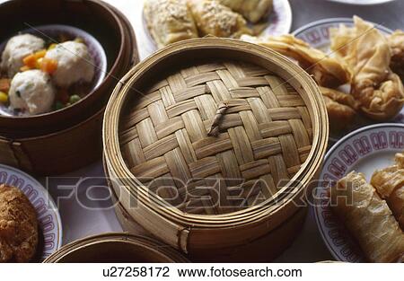 Stock Image - Dim Sum and Bamboo steamer. Fotosearch