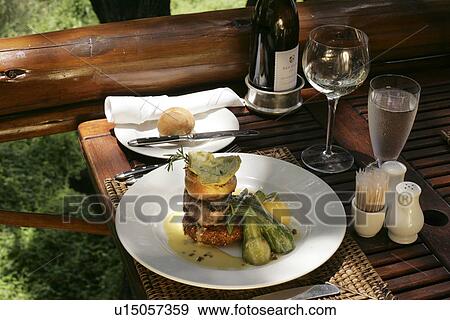 Stock Photo - Dining Al Fresco at the Tinga Legends Game Lodge. Fotosearch