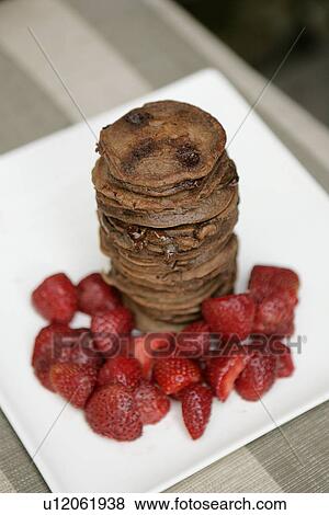 Stock Photo - Double Chocolate Pancake Stack with Strawberries. Fotosearch