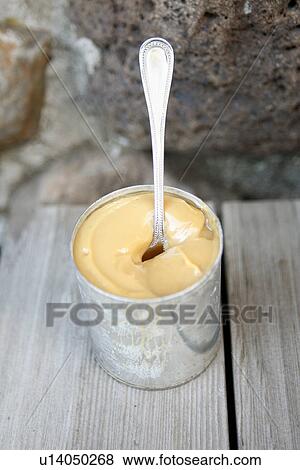 Stock Photo - Dulce de Leche in Can. Fotosearch
