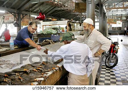 Stock Photo - Fish Monger, Port Louis, Mauritius. Fotosearch