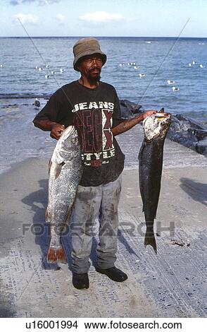 Picture - Fisherman with catch. Fotosearch