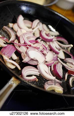 Stock Photograph - Frying Red Onion in Pan. Fotosearch