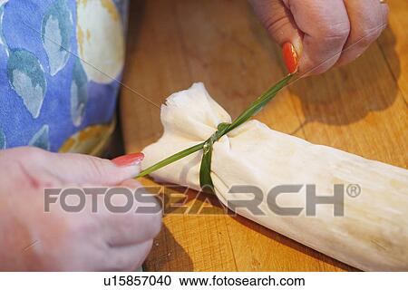 Stock Image - Gourmet Popper with Egg Filling / step shot. Fotosearch