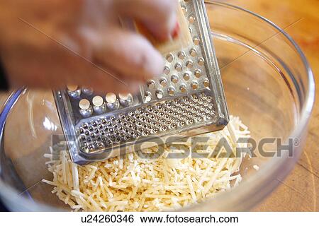 Stock Photograph - Grating Cheese. Fotosearch