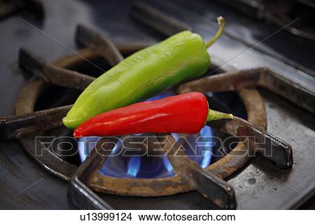 Green and Red Chili Peppers over Flame View Large Photo Image Picture - Green and Red Chili Peppers over Flame. Fotosearch